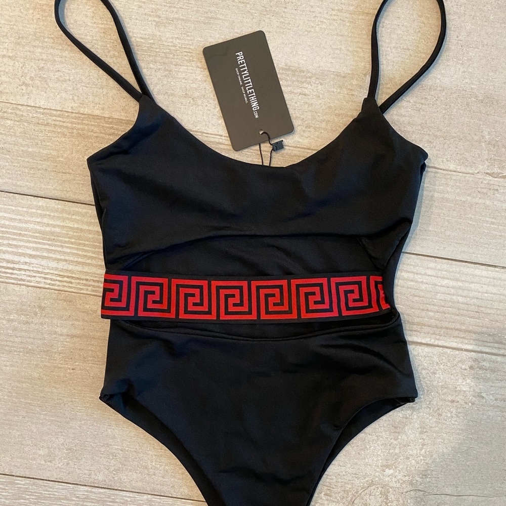 NWT black one piece swimsuit with cutout